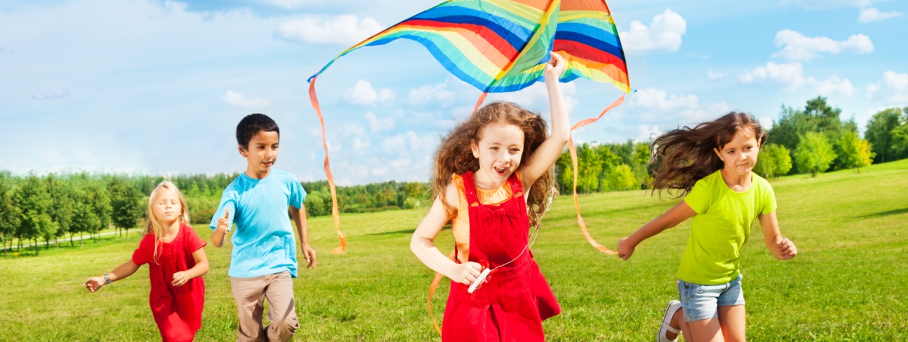 Kids running in grass Pediatric Dentist Dr. Rex Wildey in Kerrville, TX.